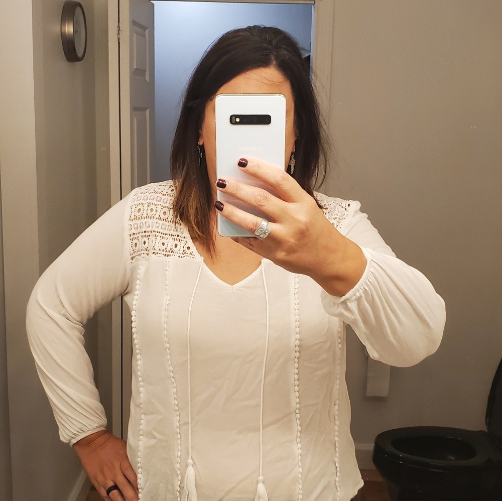 Winter white feminine blouse with crochet accents